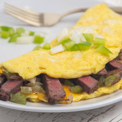 Steak Omelette With Peppers, Onions, And Mushrooms