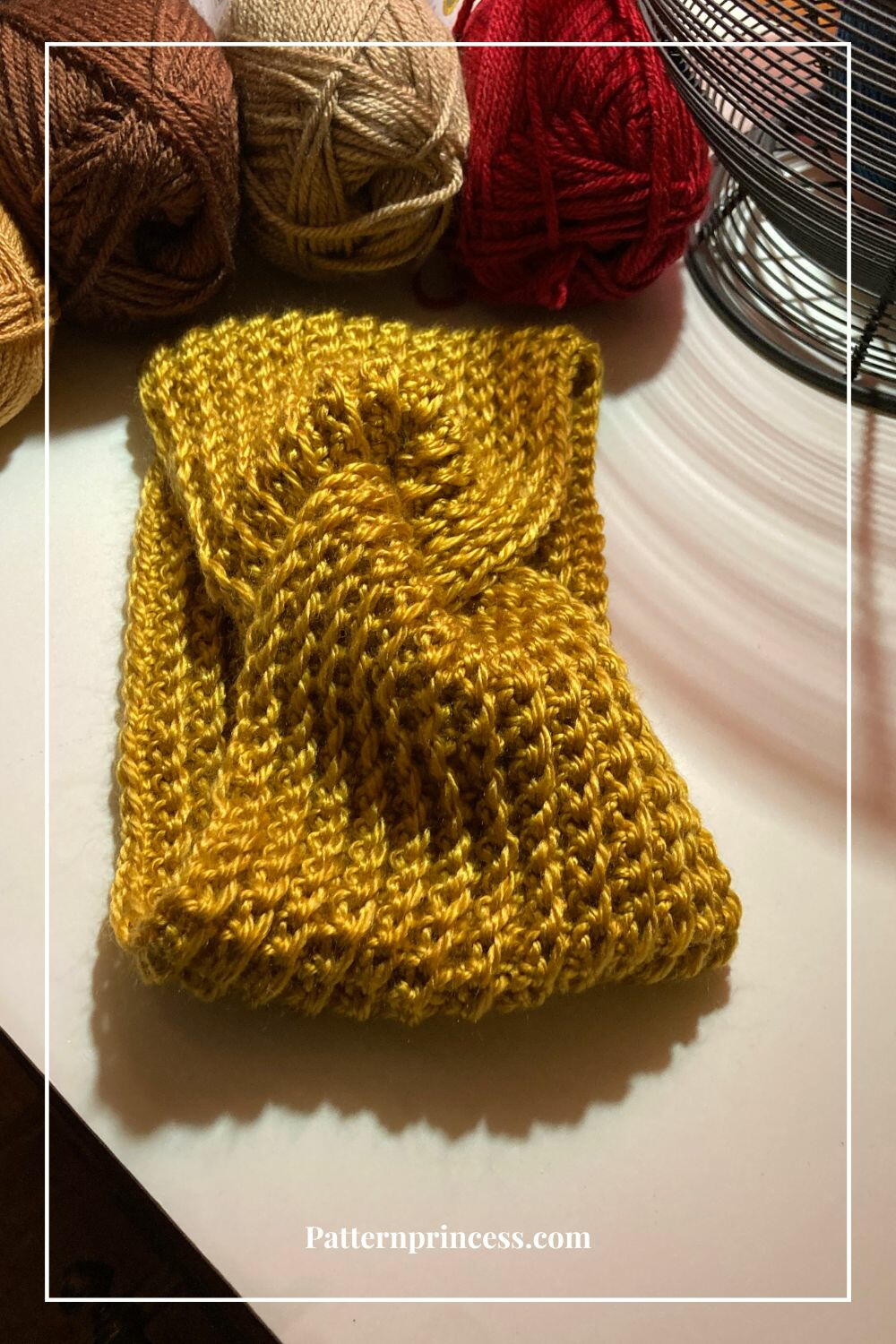 Josephine Twist Crochet Ear Warmer Headband Pattern | FaveCrafts.com