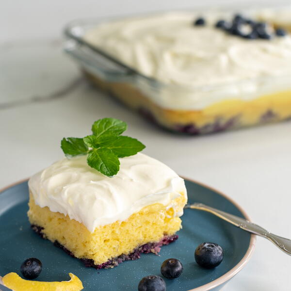 Lemon Blueberry Poke Cake With Whipped Cream Cheese Topping