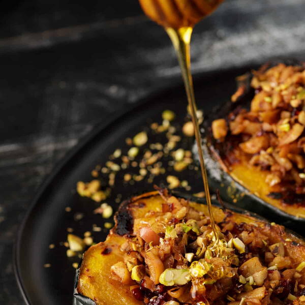 Fruit And Nut Stuffed Acorn Squash With Apples And Cranberries